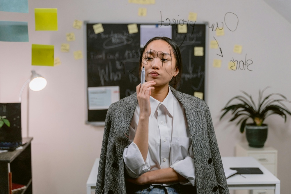 Young professional looking at see-through board