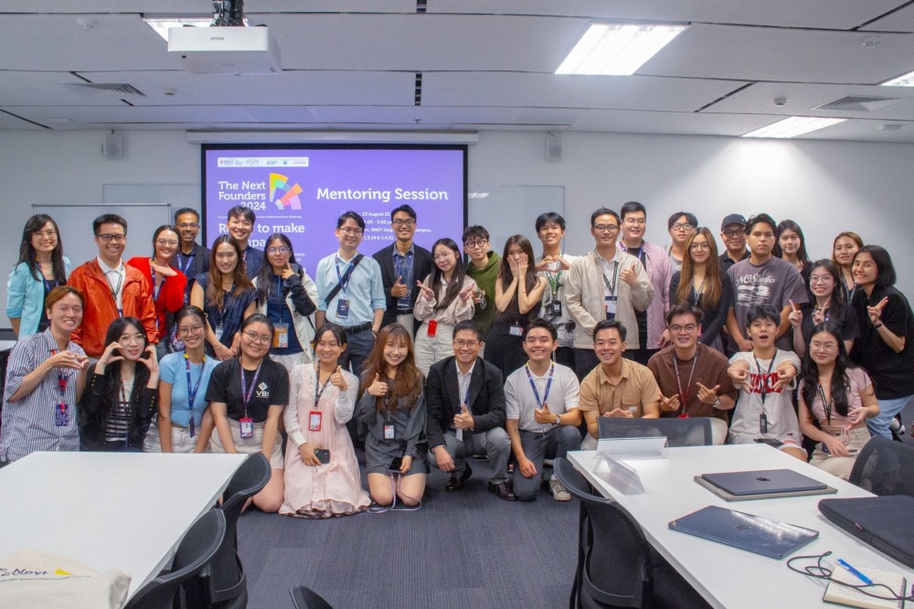 Khang with students and competition mentors
