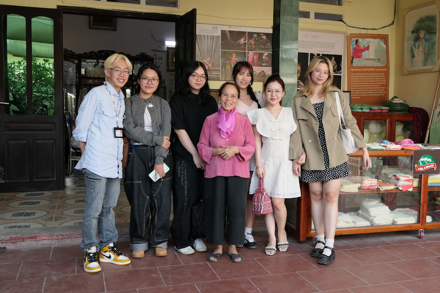 RMIT students with silk artisan Phan Thi Thuan